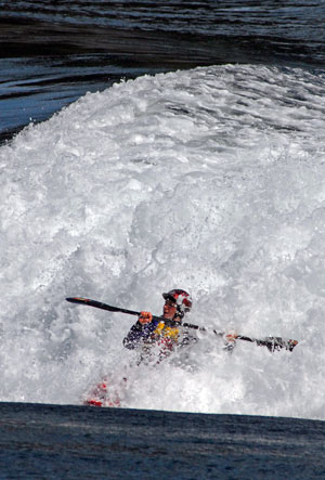 Kayak surfing at Cooper Point, Okisollo Channel, Quadra Island, BC