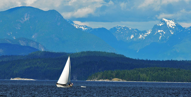 Sailboat crossing Sutil Channel, Quadra Island, British Columbia